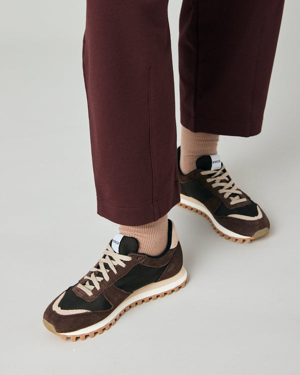 model wears burgundy huxley jersey trousers