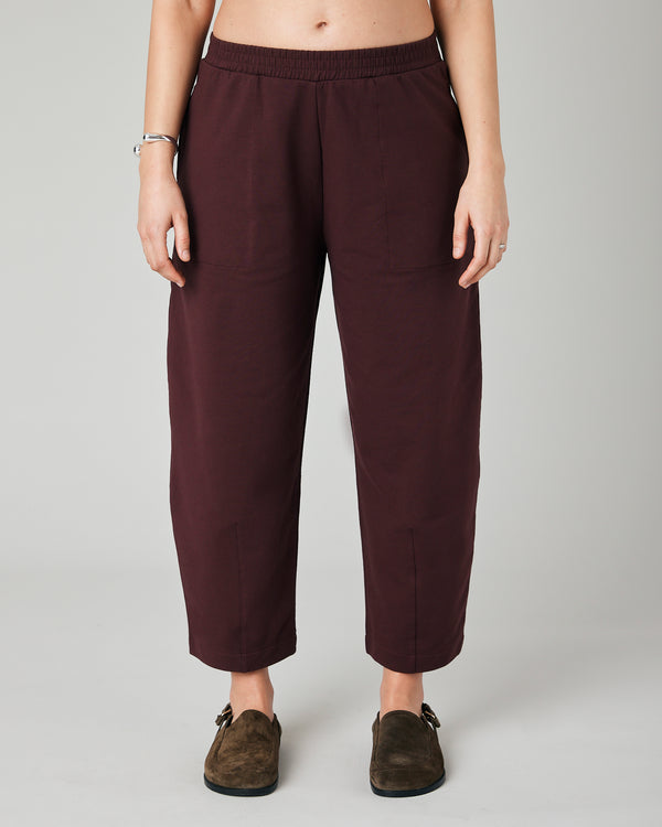 pregnant model wears burgundy huxley jersey trousers