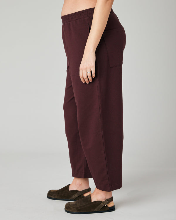 pregnant model wears burgundy huxley jersey trousers