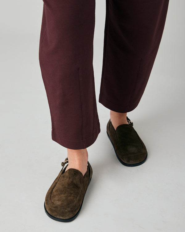 pregnant model wears burgundy huxley jersey trousers