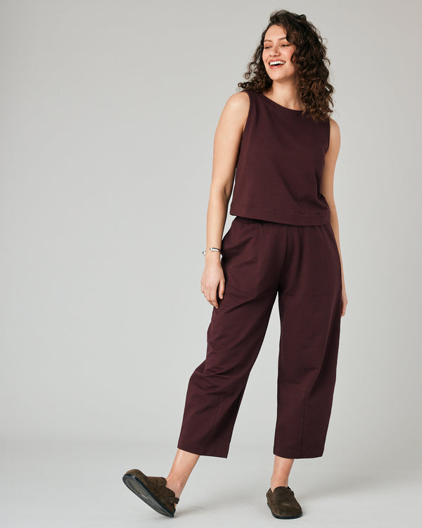 pregnant model wears burgundy huxley jersey trousers