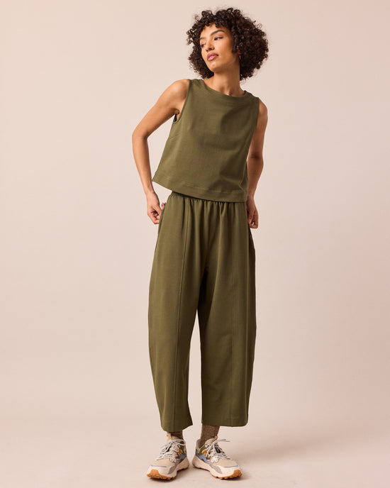 model wears esme light olive jersey top