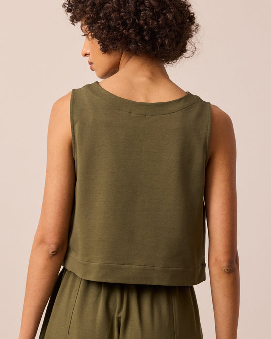 model wears esme light olive jersey top