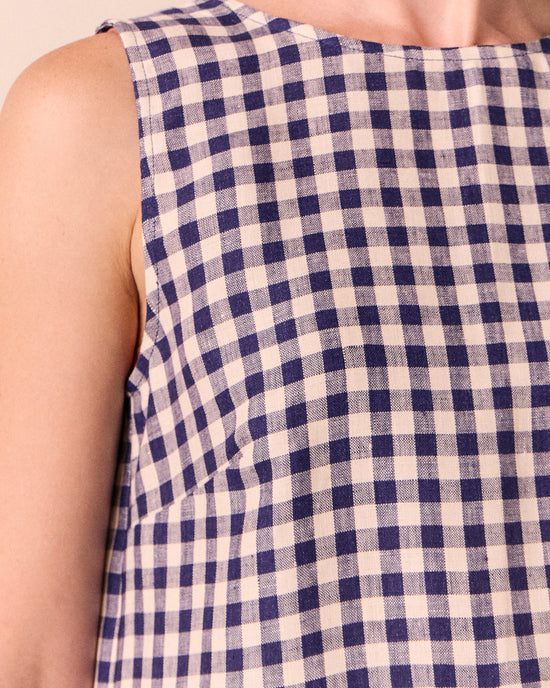 model wear esme linen indigo gingham top.