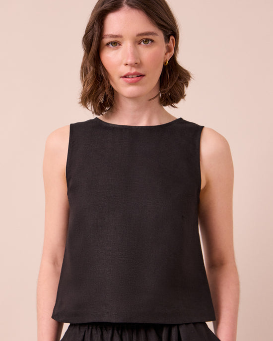 model wears esme black linen top
