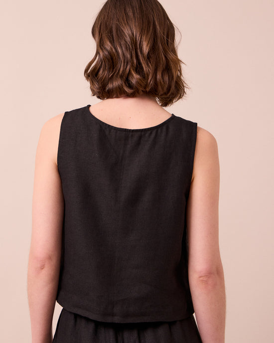 model wears esme black linen top