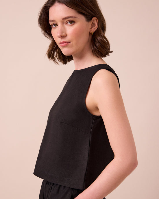 model wears esme black linen top