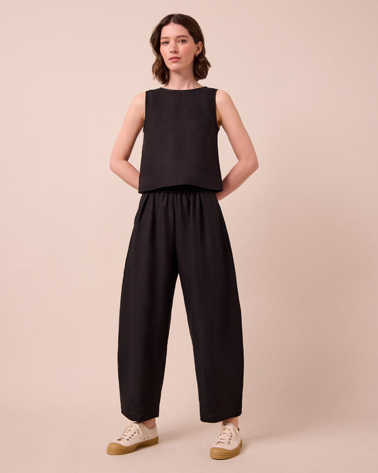 model wears esme black linen top