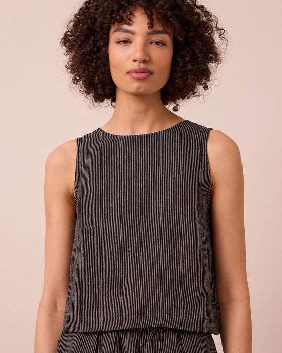 model wears esme black and ecru stripe linen top