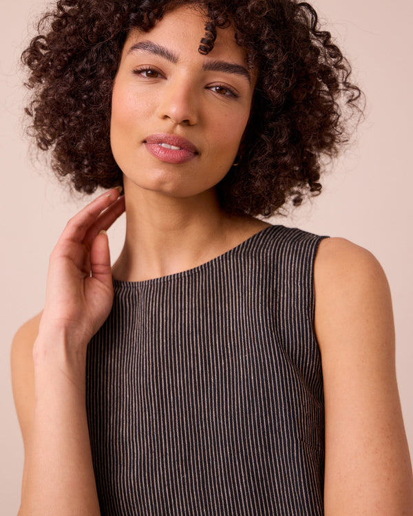 model wears esme black and ecru stripe linen top