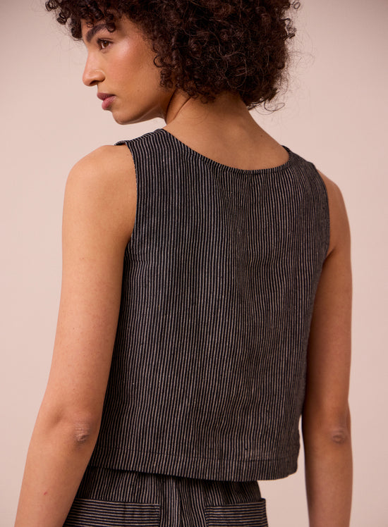 model wears esme black and ecru stripe linen top