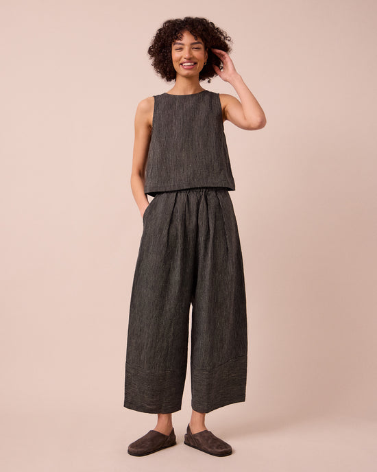 model wears esme black and ecru stripe linen top