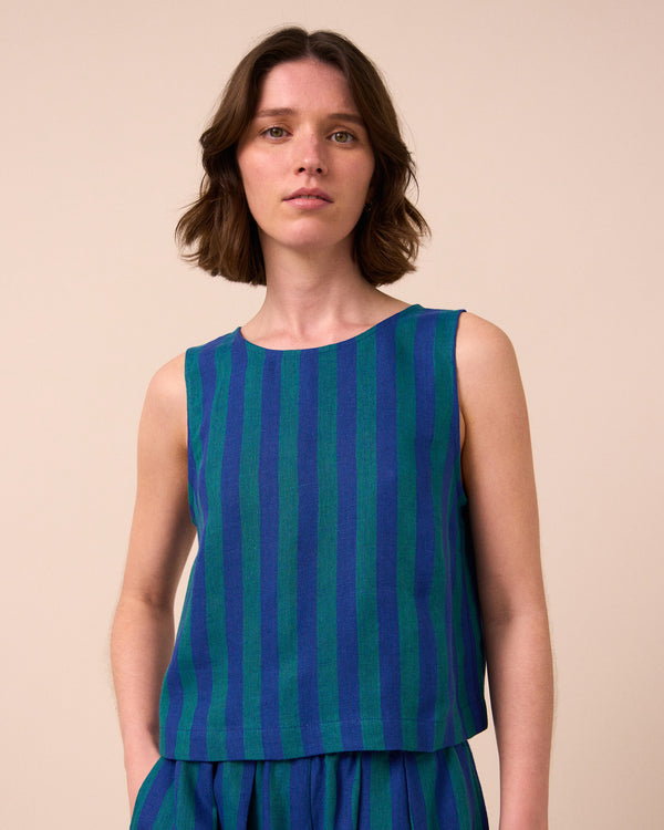 model wears esme house blue stripe linen top