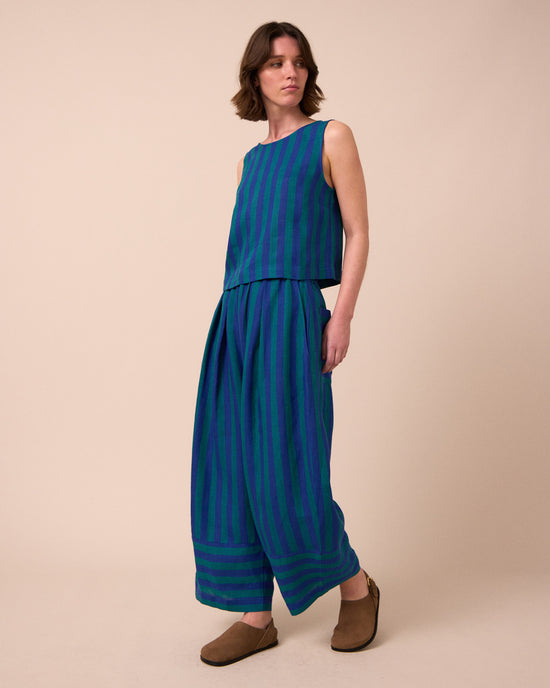 model wears esme house blue stripe linen top