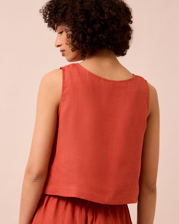 model wears esme burnt orange linen top