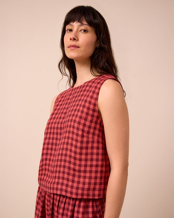 model wears esme deep rose gingham linen top