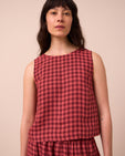 model wears esme deep rose gingham linen top