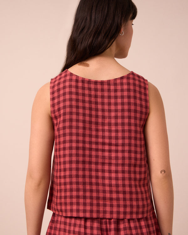 model wears esme deep rose gingham linen top
