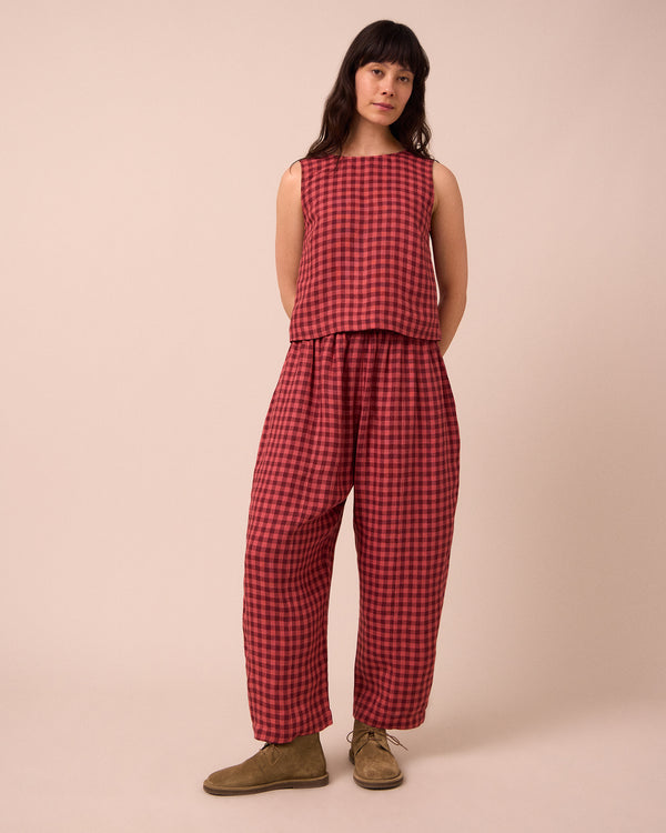 model wears esme deep rose gingham linen top