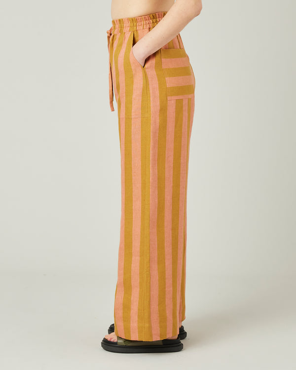 model wears pollen stripe linen lexi trousers left