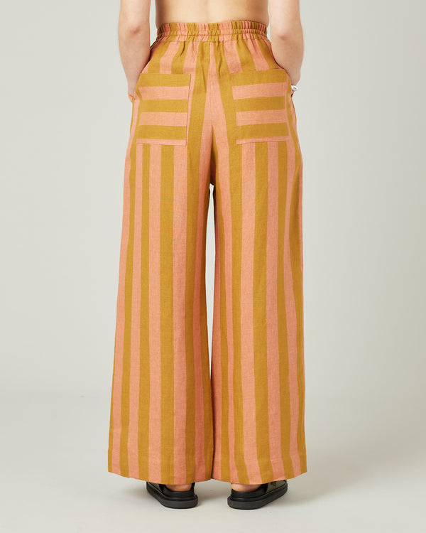 model wears pollen stripe linen lexi trousers back