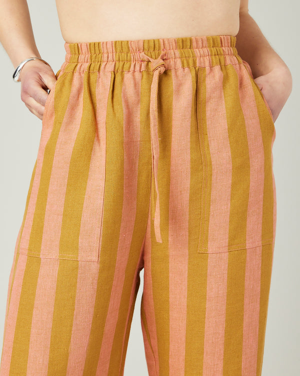 model wears pollen stripe linen lexi trousers