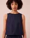 model wears esme navy linen top