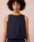 model wears esme navy linen top