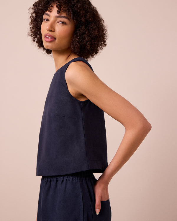 model wears esme navy linen top