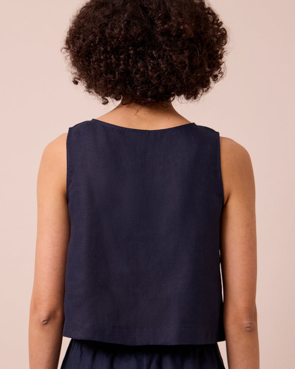 model wears esme navy linen top