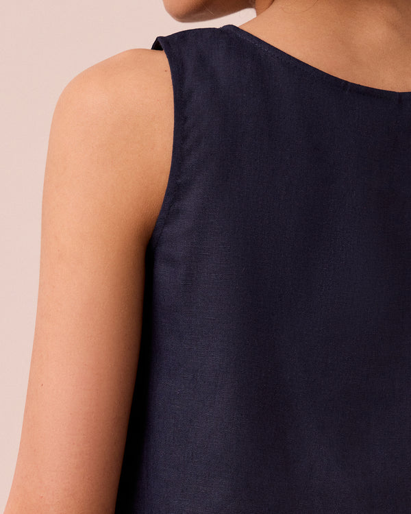 model wears esme navy linen top