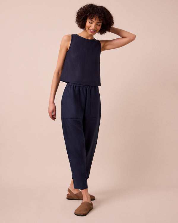 model wears esme navy linen top