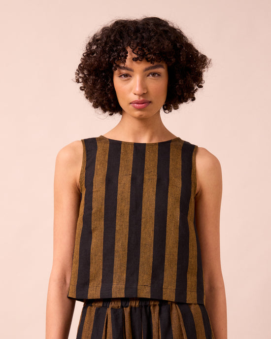 model wears esme rust stripe linen top