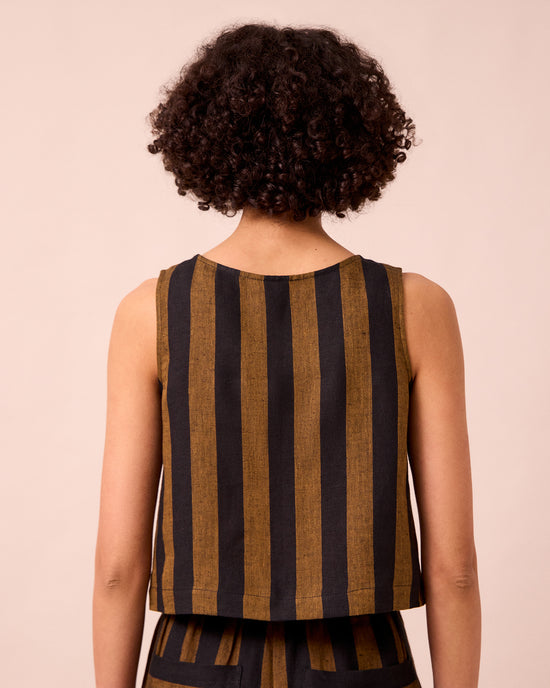 model wears esme rust stripe linen top