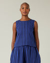 model wears indigo stripe linen esme top