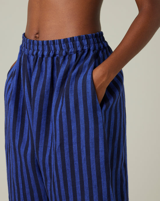 model wears indigo stripe linen mabel trousers