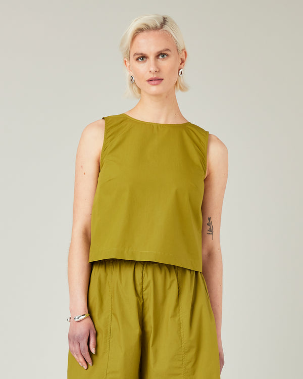 model wears olive poplin esme top