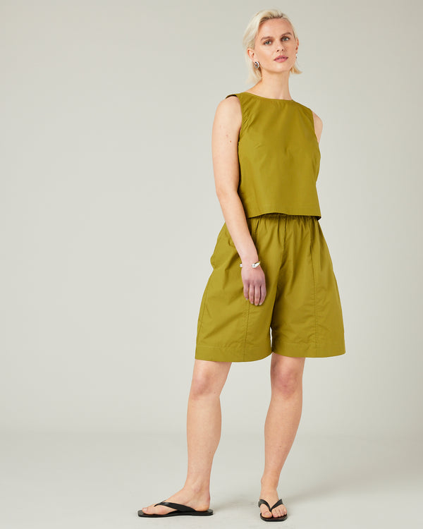 model wears olive poplin esme top