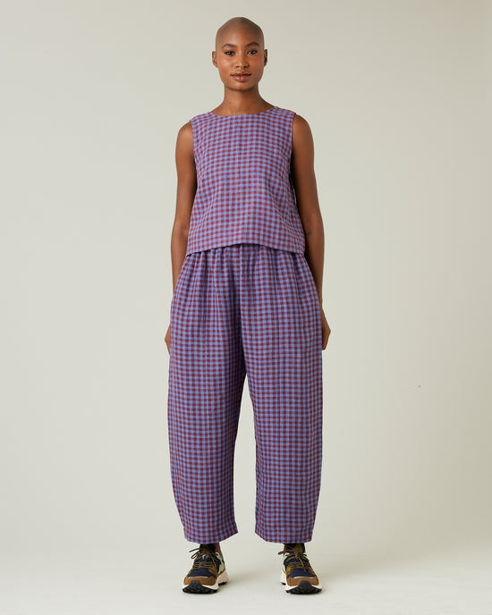 model wears blueberry check linen trousers