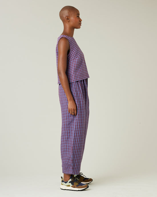 model wears blueberry check linen trousers