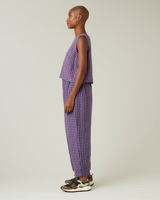 model wears blueberry check linen trousers