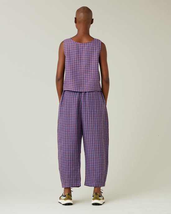 model wears blueberry check linen trousers