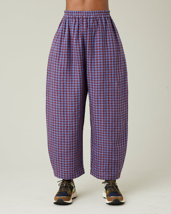 model wears blueberry check linen trousers from the front