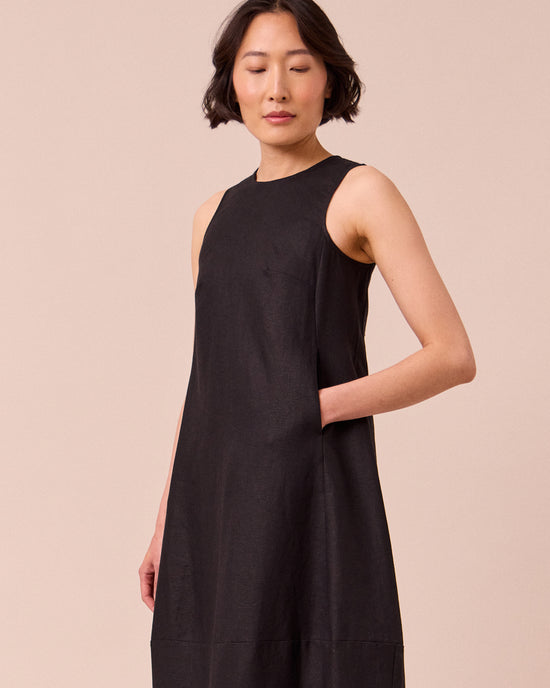 model wears etta black linen dress