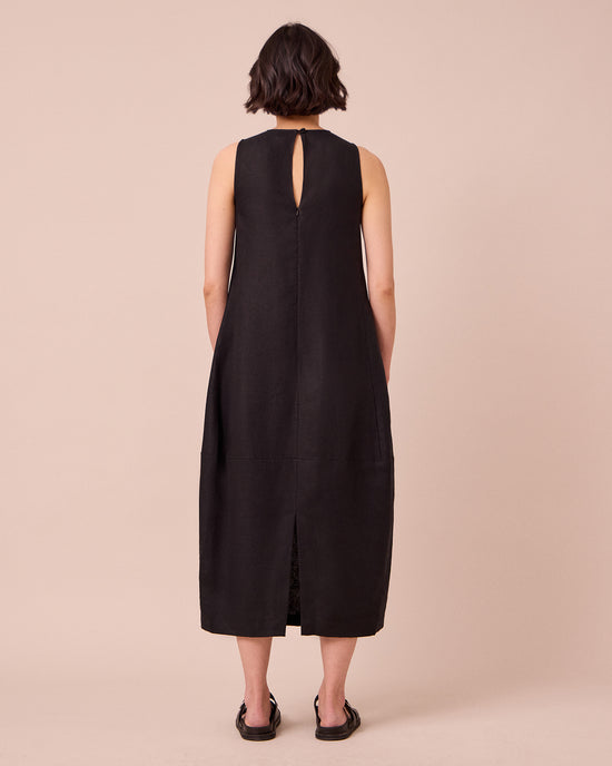 model wears etta black linen dress