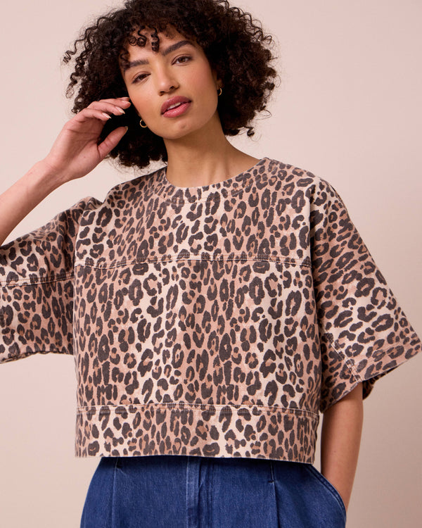 model wears eva leopard print denim top
