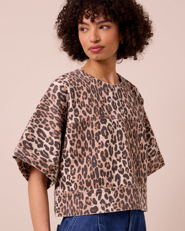 model wears eva leopard print denim top