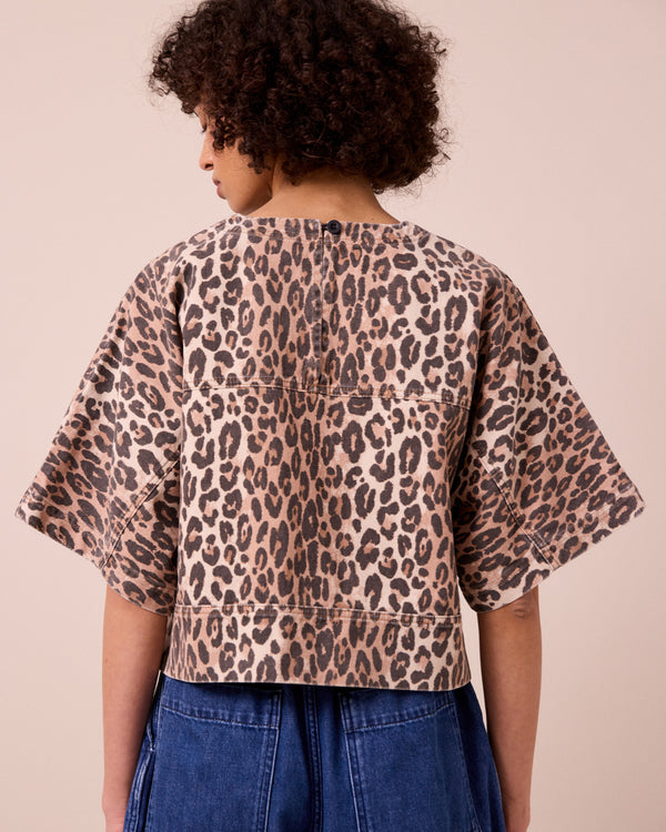 model wears eva leopard print denim top