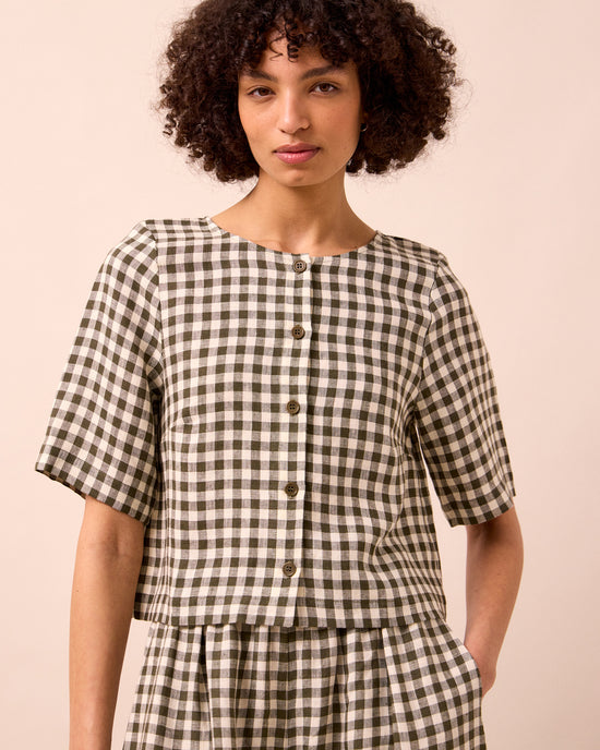 model wears evelyn olive gingham linen top