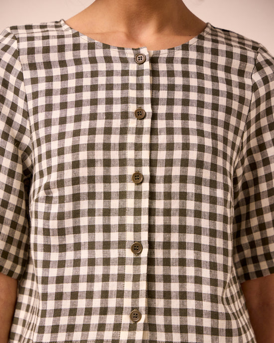 model wears evelyn olive gingham linen top